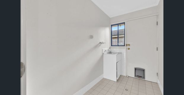 Neat and Tidy Three-Bedroom Home in a Great Location! - Photo 1