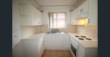 TWO BEDROOM UNIT - TOP FLOOR WITH GARAGE - Photo 2