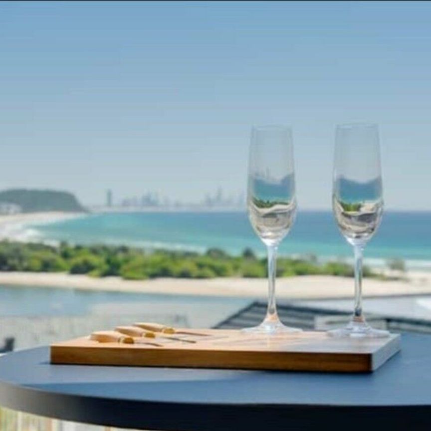 BREATHTAKING OCEAN VIEWS! MODERN TWO BEDROOM FURNISHED APARTMENT - Photo 1