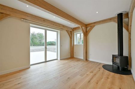 A grand oak-framed country home with vaulted ceilings and striking architectural detail - Photo 3