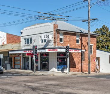 Two bedroom unit above bike shop in great central location. - Photo 6