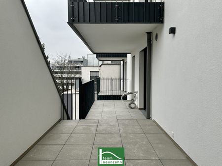 Geräumiger 2-Zimmer-Erstbezug mit großzügiger Freifläche, Klimaanlage, Einbauküche & Tiefgaragenstellplatz! - Photo 3