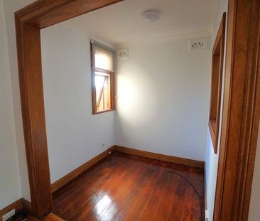 Character filled freestanding home with parking - Photo 4