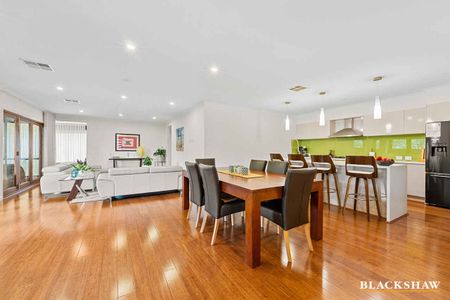 Welcoming Family Home with Open Living Spaces and Home Office - Photo 3