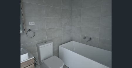 Near new, split level, spacious two bedroom, two bathroom apartment in quiet location only metres from Homebush Train Station - Photo 5