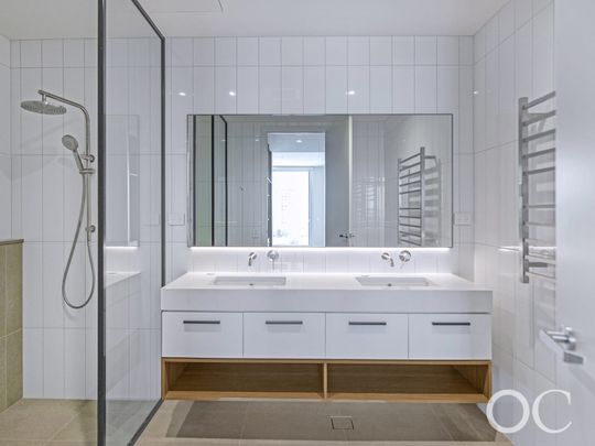 Open the Door to Luxurious Sub-Penthouse Living with Panoramic Coastal and River Views - Photo 1