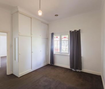 This beautifully presented, spacious three-bedroom home is ideally ... - Photo 2