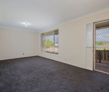 Tidy 3 Bedroom Home with Large Backyard! - Photo 1