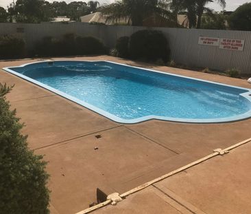 Tidy Unit in a Gated complex with sparkling pool! - Photo 3