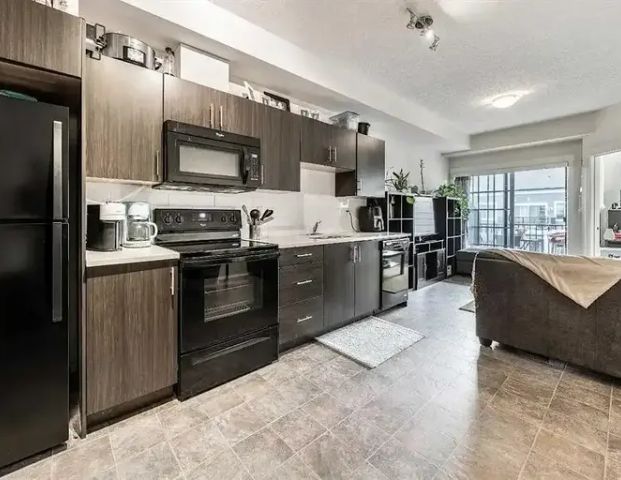 Cozy 2 Bedroom 2 Bathroom Apartment with Titled Parking! | 1403 - 215 Legacy Boulevard Southeast, Calgary - Photo 1