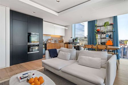 A top floor two bedroom apartment with stunning views in the Barts Square development. - Photo 2