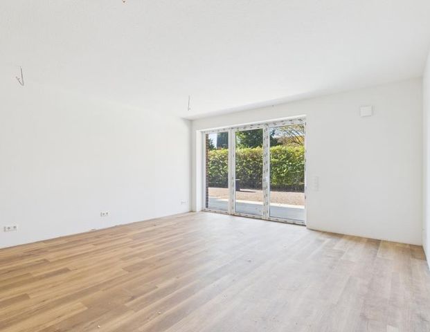 Moderne Erdgeschosswohnung mit Terrasse – Erstbezug in ruhiger Lage - Foto 1