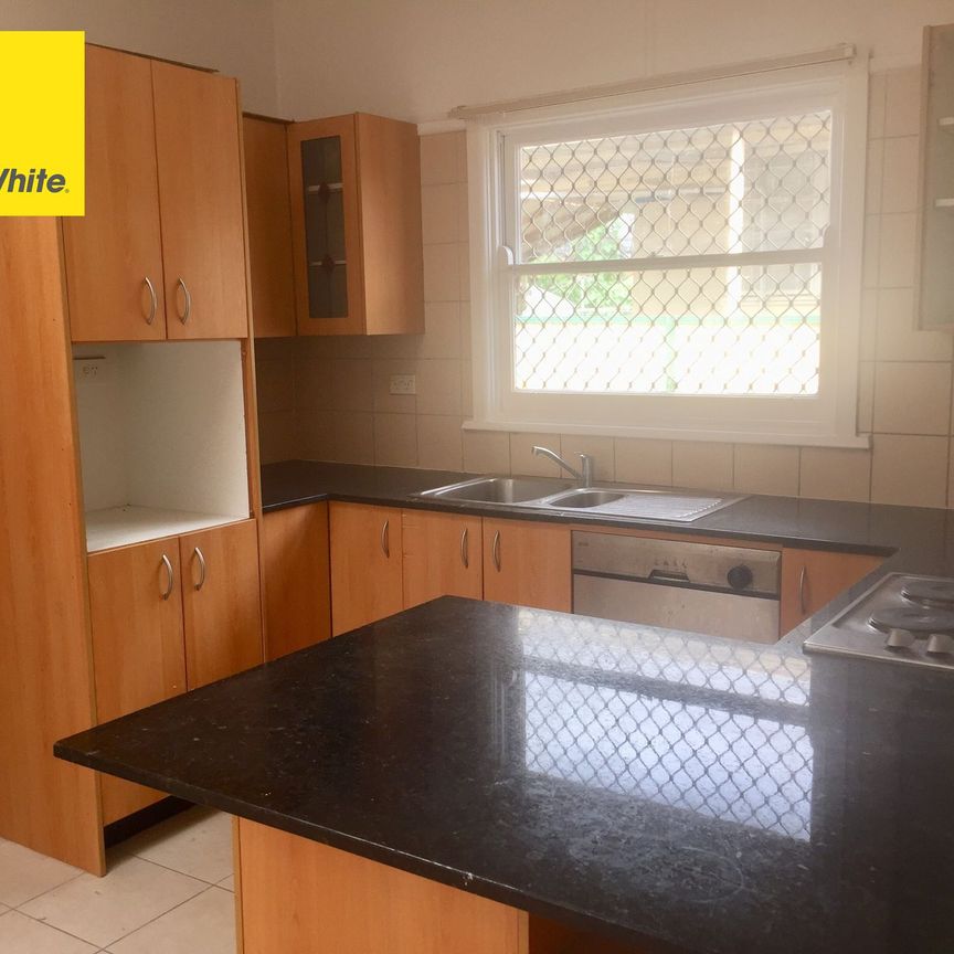 Spacious 4-Bedroom Home in a Convenient Location! - Photo 1