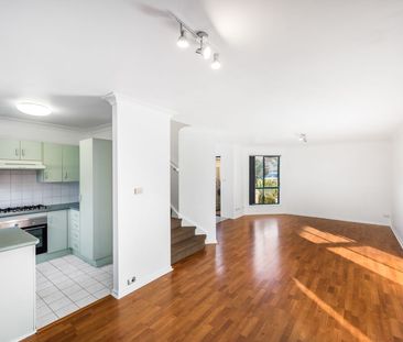 IMMACULATE TOWNHOUSE WITH POOL - Photo 1