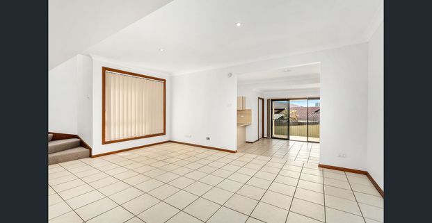 MODERN AND COMFORTABLE LIVING IN A WELL-DESIGNED BLACKBUTT DUPLEX - Photo 1