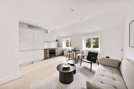 An impeccably designed top floor, 1 bedroom apartment with ample storage. - Photo 2