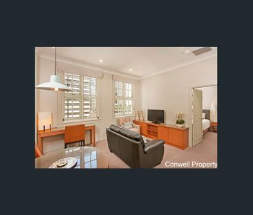 RENOVATED 1 BEDROOM FULLY FURNISHED TOP FLOOR CBD HERITAGE APARTMENT - Photo 2