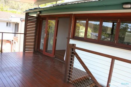 “Enjoy cool breeze on Nathan Heights, Solar power, plus LARGE useable space downstairs all closed in perfect for home office or gym.” - Photo 5