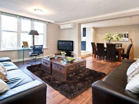 This three bedroom apartment is set on the fourth floor of a private gated development set in communal gardens. - Photo 2