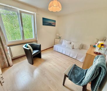 Bright and close to the center / Concierge service available! - Photo 1