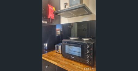 PARTIALLY FURNISHED - MOVE STRAIGHT IN - Photo 4