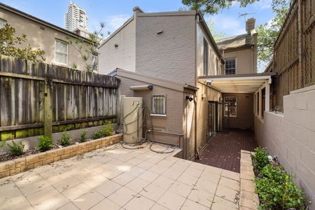 Three-Level Renovated Home with Private Courtyard - Photo 4