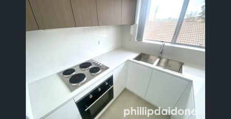 OPPOSITE TRAIN STATION, RENOVATED 2-BEDROOM UNIT - Photo 3