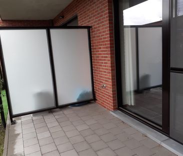 Modern gelijkvloers appartement in het centrum met tuin - Foto 1