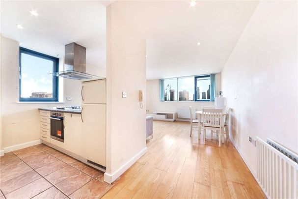 This property is conveniently situated in zone 2, providing excellent transportation connections to central London, with easy access to All Saints DLR station nearby. - Photo 1