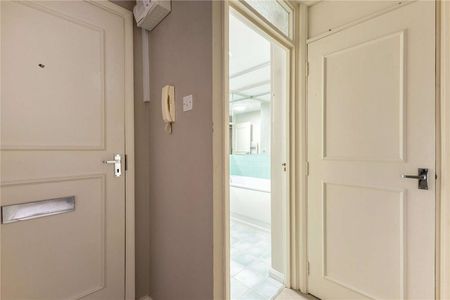 A bright and centrally located, two bedroom second floor apartment with off street parking - Photo 4