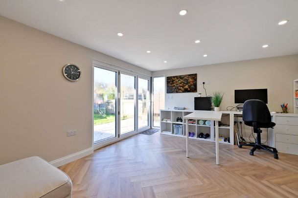 This versatile bungalow includes three bedrooms, principal with dressing room and ensuite, a stunning open plan kitchen with bi-fold doors, and a garden with a heated studio and WC. - Photo 1