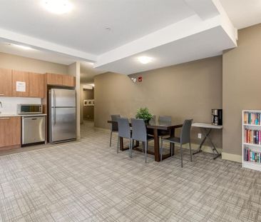 Beautiful South Facing Top Floor One Bed and Den Condo in Cloverdale - Photo 2