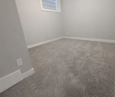 Brand New 2 Bedrooms, 1 Full Bath legal Basement Suite, Available i... - Photo 1