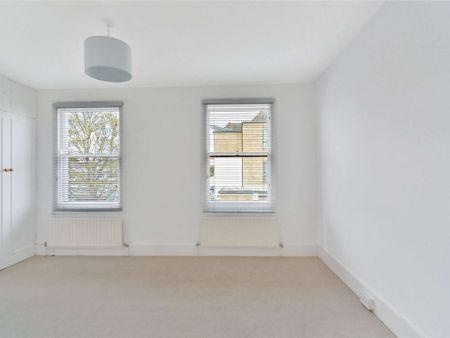 An ideal three bedroom cottage well located "between the commons" - Photo 3