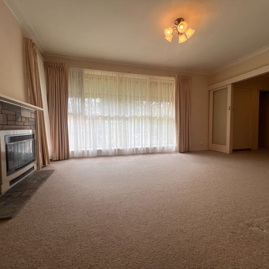 Comfortable Three-Bedroom Home in a Convenient Location - Photo 1