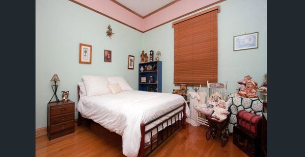 Modern Tranquillity in the Heart of Convenience – Stylish 4-Bedroom, 2-Bathroom Home - Photo 1