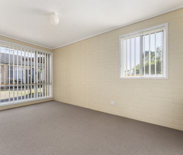 Tidy Two-Bedroom Unit in the Heart of Town - Photo 2