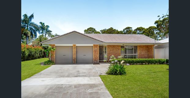 A Comfortable Family Home in a Peaceful Bayside Setting - Photo 1