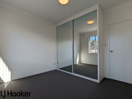 Spacious 3-Bedroom Unit in Quiet Street with Lock up Garage and Built-ins - Photo 4