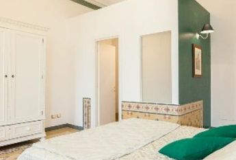 Center-Historic Jewish Quarter: Elegant apartment situated in beautiful Palazzo Nobiliare. Entrance, spacious living with original wood frescoed ceilings, large modern dining and kitchen, 4 bedrooms, 4 Baths, small terrace. #1527