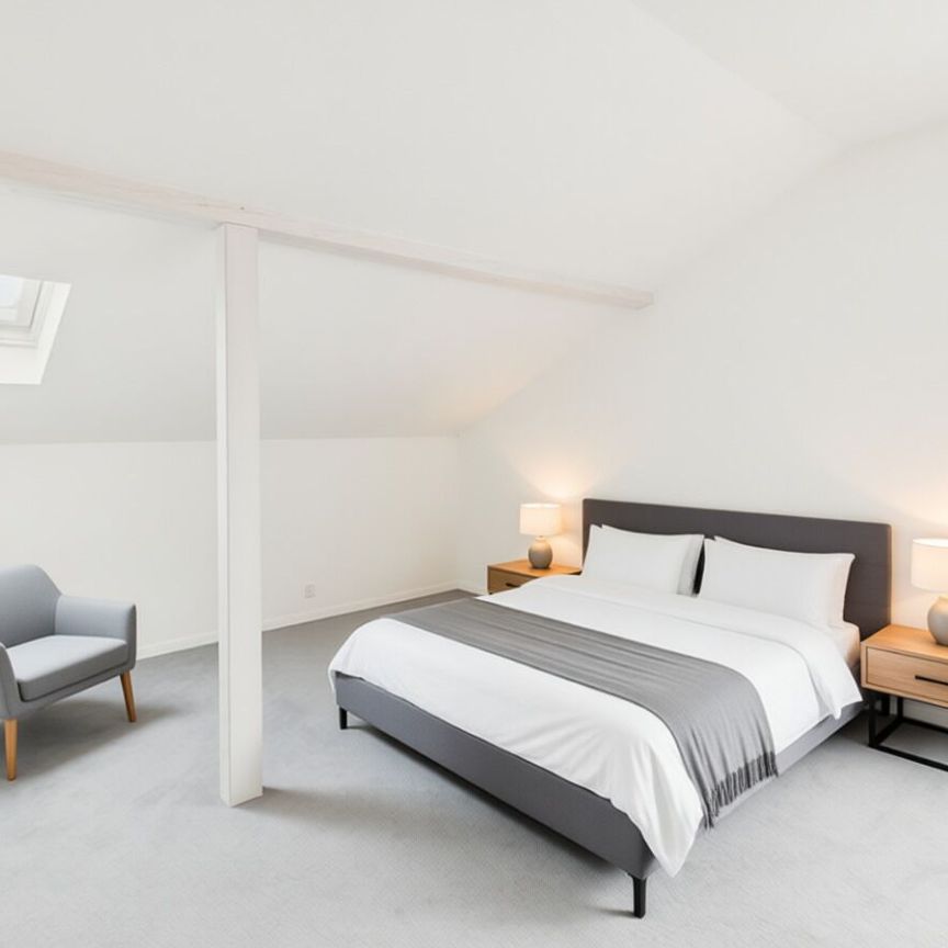 Charming 2.5-room penthouse apartment in Lyss - Photo 1