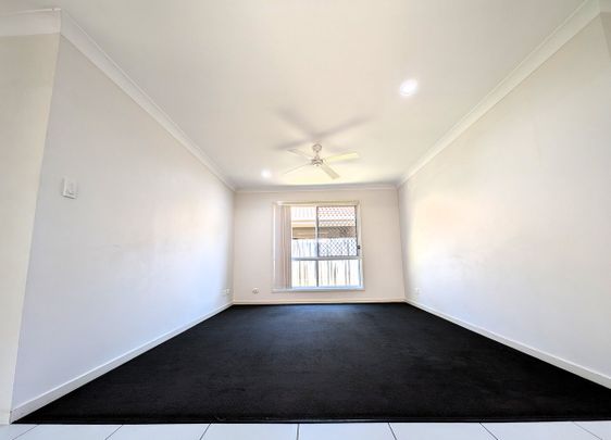 Private Oasis Backing Onto Bushland – Spacious Family Living in Prime Location - Photo 1