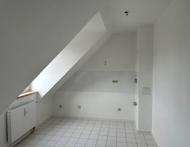 Schöne 2-Zimmer Dachgeschosswohnung in idyllischer Lage - Foto 1