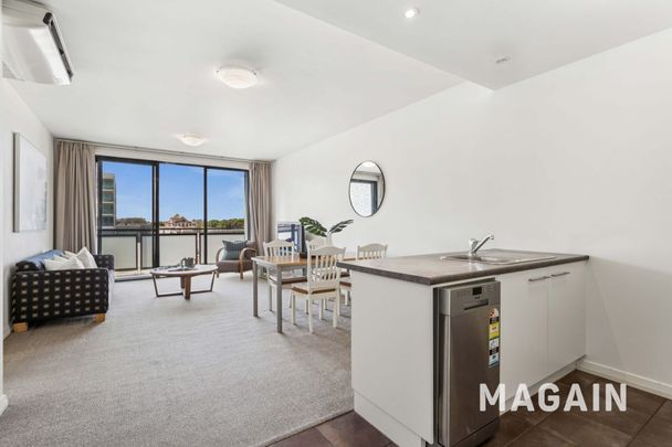 Spacious City Living with Expansive Wrap-Around Balcony & Secure Parking - Photo 1