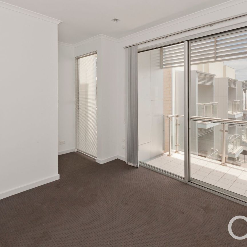 Open the Door to City Serenity with a Private Balcony - Photo 1