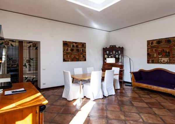 Attic-Monti: 1-6 month rentals. Spacious, furnished 3 Bedroom, 2 bath, living room, dining room, study and large panoramic terrace. Bright, silent, located in well kept Palazzo d’Epoca with elevator and doorman. Near transport and Metro.