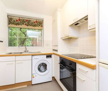 A two bedroom apartment set on the first floor of this centrally lo... - Photo 1