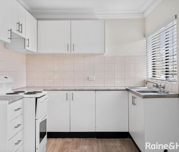 Top Floor Unit in Ideal Location - Photo 1