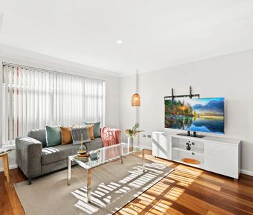 Light Filled Apartment with Oversized Lockup Garage - Photo 1