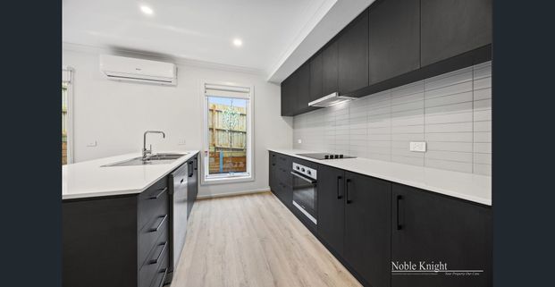 Contemporary Townhouse Living – Walk to Everything - Photo 1